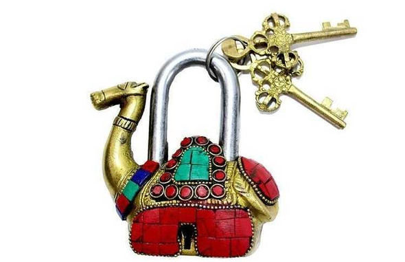 A professional product presentation of the exclusive handmade brass camel lock from a premier UAE shop.