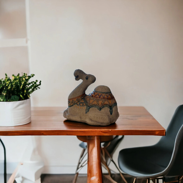 High-quality ceramic sculpture of a camel, showcasing skilled craftsmanship and artistic hand-painted details.