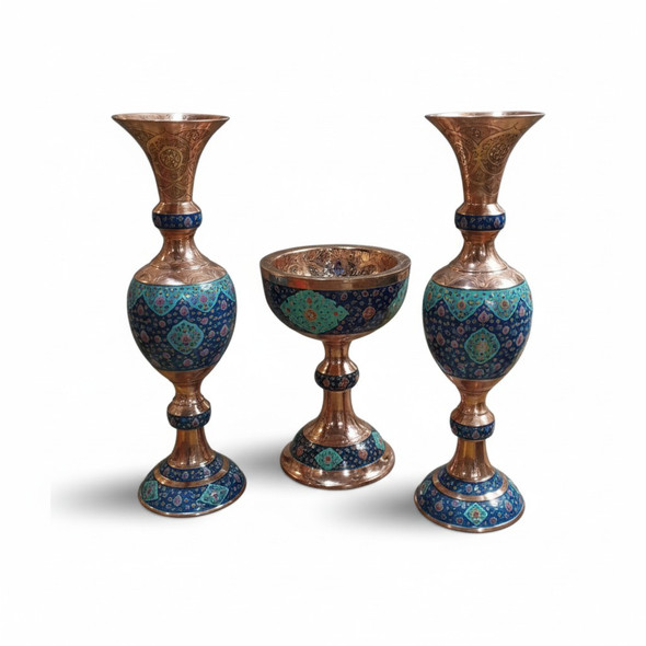 Close-up of the intricate floral engravings and sculpted base of the copper pedestal fruit bowl.