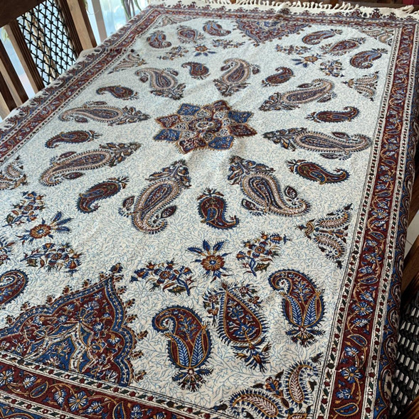 A professional product shot of the 150x100 cm hand block printed textile laid out on a neutral studio background.