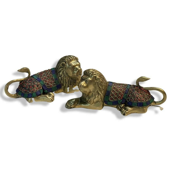 Two elegantly crafted brass lion figures, ideal as a sophisticated centerpiece