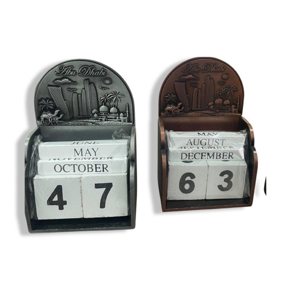 Perpetual desk calendar with wooden blocks and an Abu Dhabi skyline relief, ideal as a unique, lasting souvenir gift.