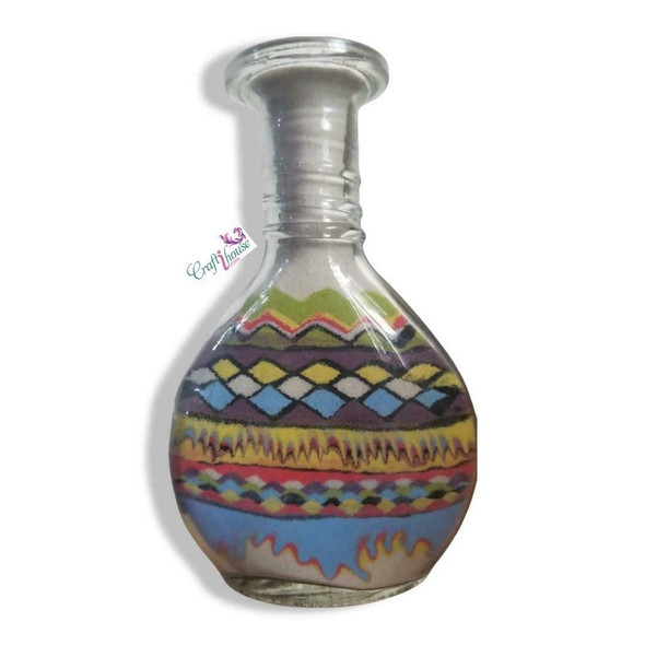 A 13 cm handcrafted glass bottle featuring intricate hand-layered sand art of a camel caravan in the Dubai desert.
