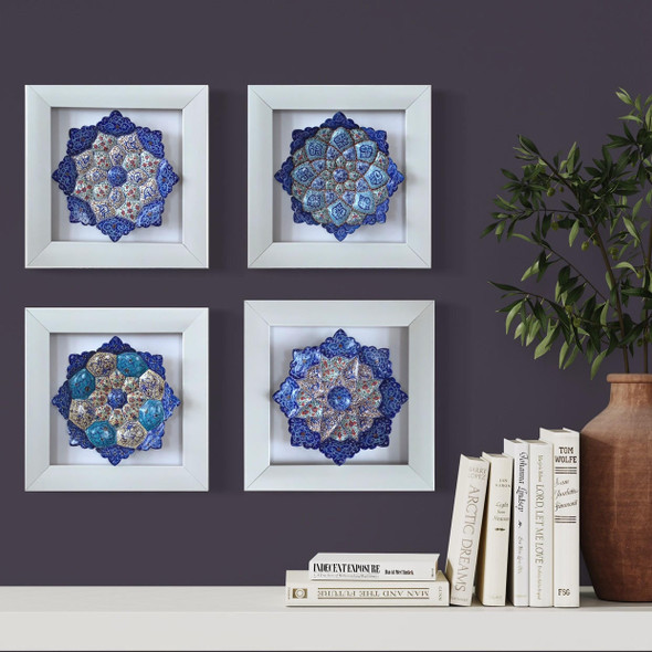 professional product presentation of the set of 4 framed 16 cm hand-painted copper plates against a neutral background.