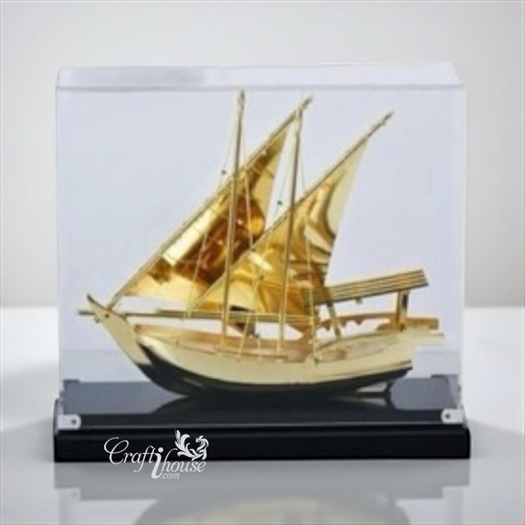 A 29 cm luxury gold-plated Dhow model ship displayed inside a clear museum-grade acrylic gift box.