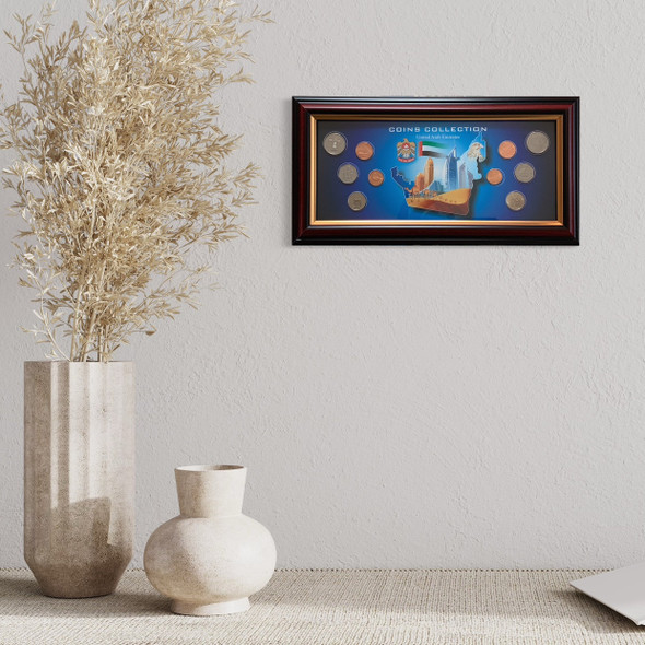 Premium boxed souvenir display of authentic UAE currency and national iconography.