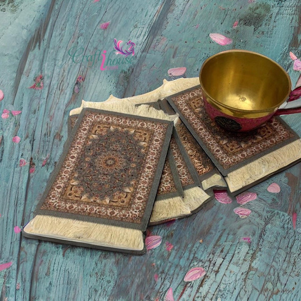 A professional product presentation of the exclusive Persian carpet coaster set from a premier UAE shop.