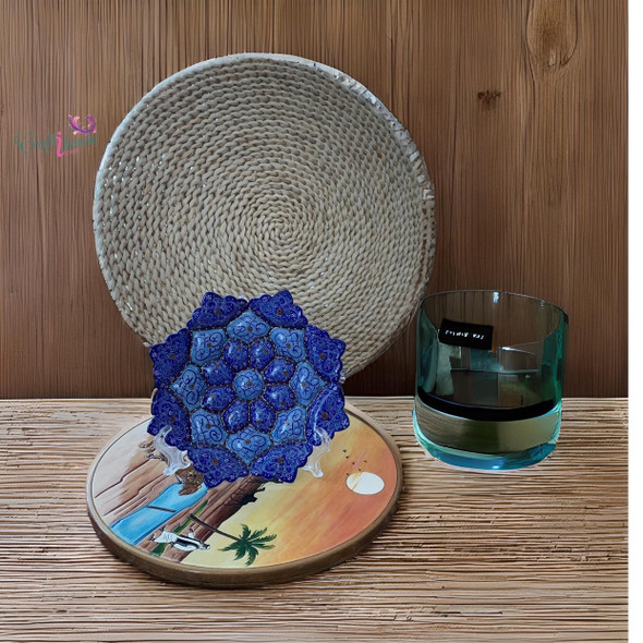 A professional product presentation of the exclusive handmade royal blue petal Minakari copper art piece from a premier UAE shop.