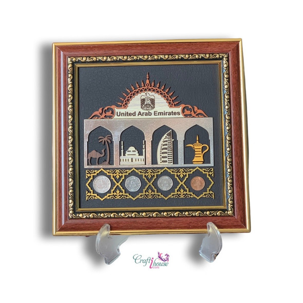 A professional product shot of the 23x23 cm Emirates collectible coins frame styled neatly on a white surface.
