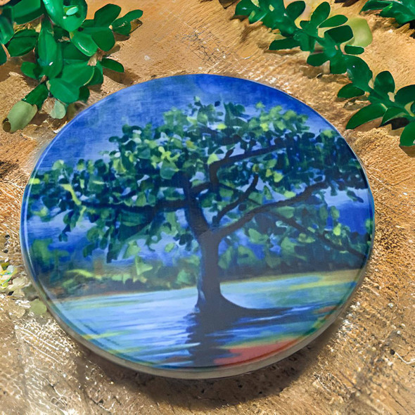 A premium Craftihouse ceramic coaster showcasing the Ghaf tree, designed to add cultural significance and beauty to any tabletop setting.