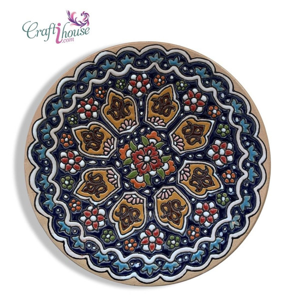 A professional product presentation of the 16 cm embossed pottery wall plate against a clean white background.