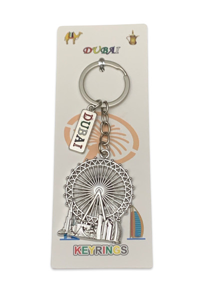 A professional product presentation of the decorative Dubai souvenir keychain from a premier UAE gift shop.