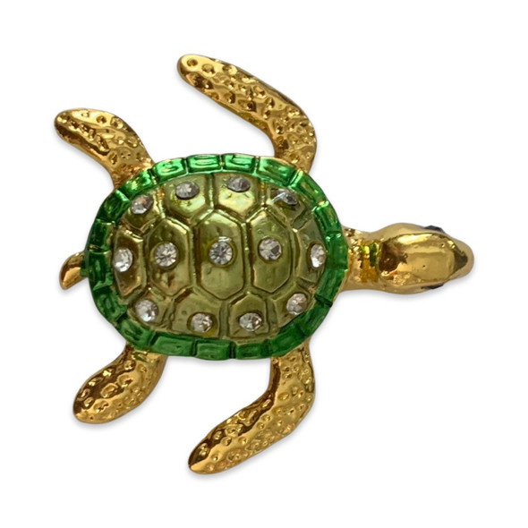 A professional product presentation of the turtle fridge magnet from a premier UAE gift and souvenir shop.