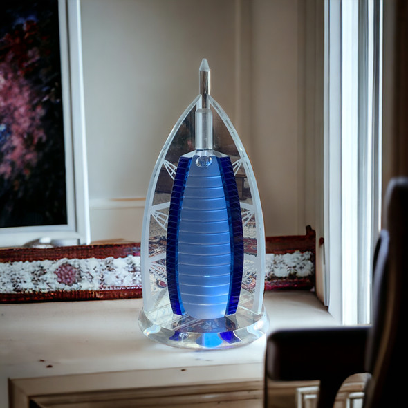 Close-up of a premium glass ornament inspired by Dubai’s iconic Burj Al Arab landmark.