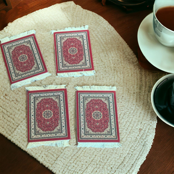 A professional product presentation of the 11x8 cm miniature rug coasters against a wooden tabletop background.