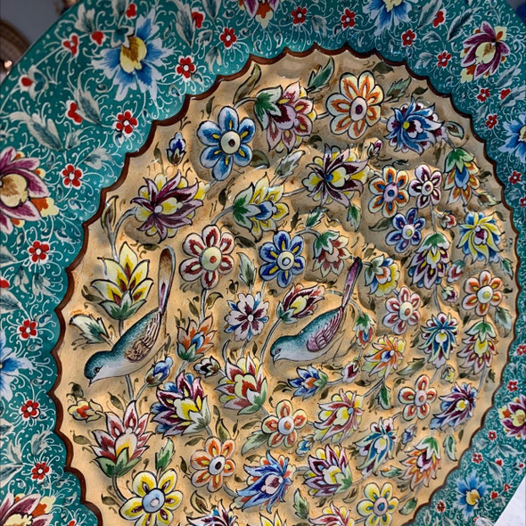 The "Nightingale's Song" blue enamel plate shown as a prestigious 30 cm decorative wall feature in a modern luxury office setting in Dubai.