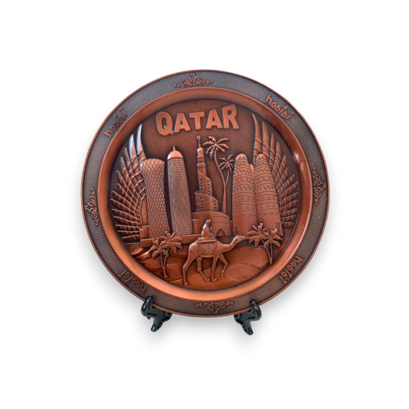 Elegant metal collectible plate with "Qatar" and "habibi" inscriptions.