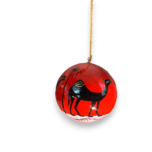 Close-up of a 3" paper mache ornament with traditional camel motif and gold hanging cord.