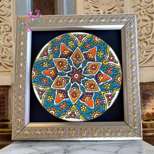 Multiple framed Minakari plates displayed in a luxury boutique hotel lobby