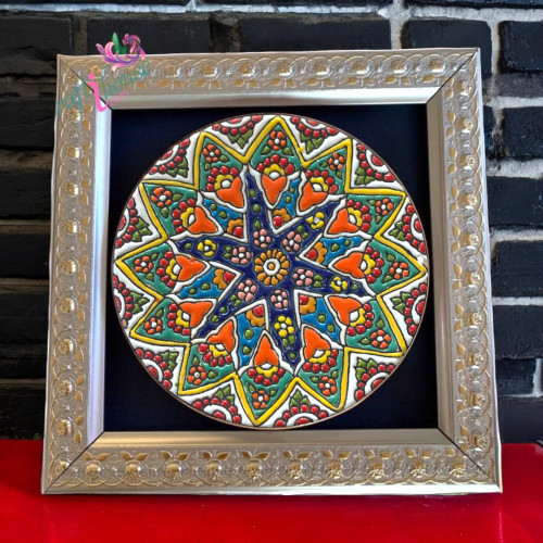 Small 22x22 cm framed Minakari plate sitting next to a laptop on a desk.