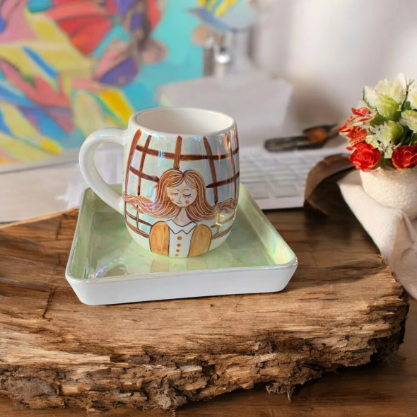 A professional product presentation of the exclusive hand-painted ceramic spring girl mug set from a premier UAE gift shop.