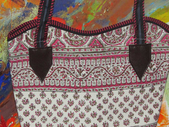 Detailed close-up showing the unique, artistic block-printed motifs and high-quality craftsmanship of our cotton handbag.