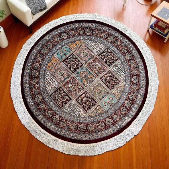 Lifestyle presentation of the 100 cm fine round machine-made silk rug styled elegantly beneath a designer coffee table, near an armchair, or in an entryway as a luxury focal point.