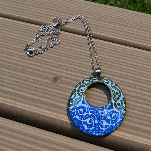 Handcrafted round Minakari enamel pendant featuring green and blue tones