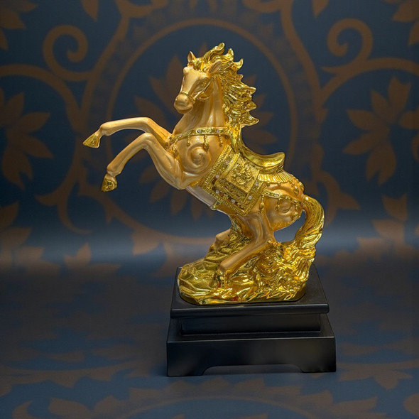 Detailed view of a gold-tone stallion figurine with an ornate saddle, standing 30cm high.