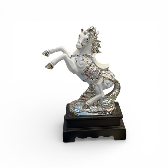 Ornate gold-finished resin horse figurine featuring a decorative saddle, perfect for a luxury housewarming gift.