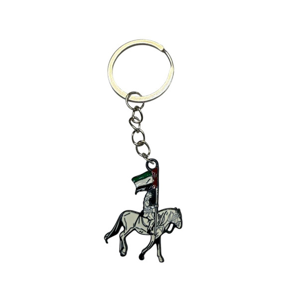 A premium enamel keychain featuring a rider on a white Arabian horse carrying the United Arab Emirates flag.