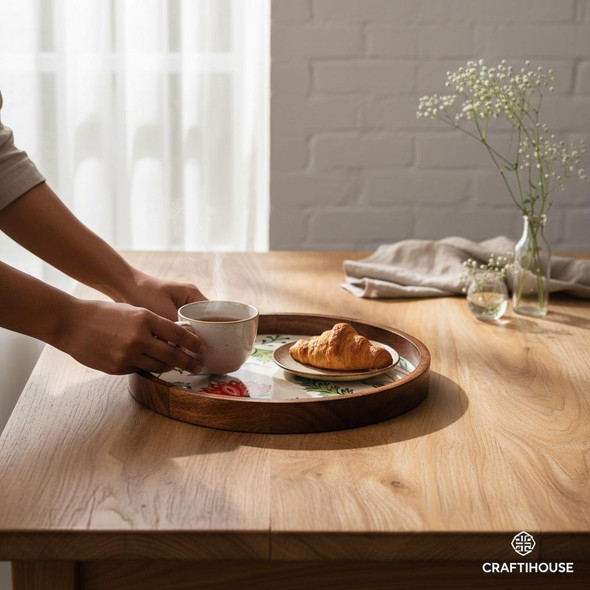 Close-up of the intricate crane and botanical foliage design inside the handcrafted mango wood serving bowl.