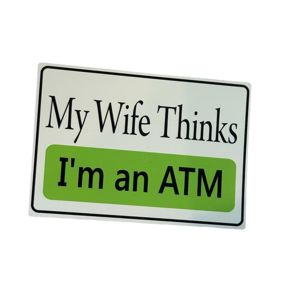 A 14x10 cm aluminum magnet with the text 'My Wife Thinks I'm an ATM' in bold black letters on a white and green background.