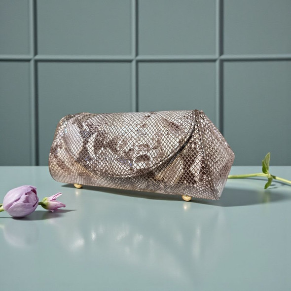 The Darya 24x10 cm handmade cow leather clutch with a luxury python-embossed pattern and gold chain.