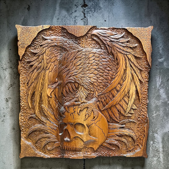 Close-up of the exterior carving featuring a highly detailed eagle clutching a skull on a wooden backgammon case.