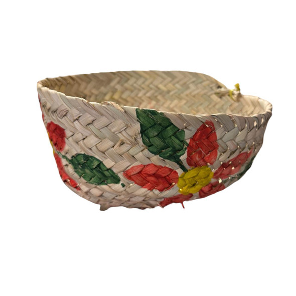 The 23 cm palm leaf basket shown with its lid off, showcasing its spacious interior for fruit or home storage.