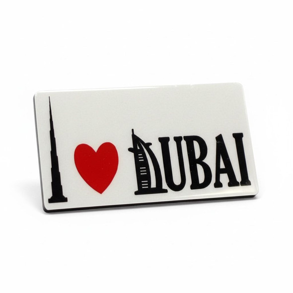 A 6.5x3.5 cm customized aluminum fridge magnet featuring a vibrant print of the Burj Khalifa and Dubai skyline