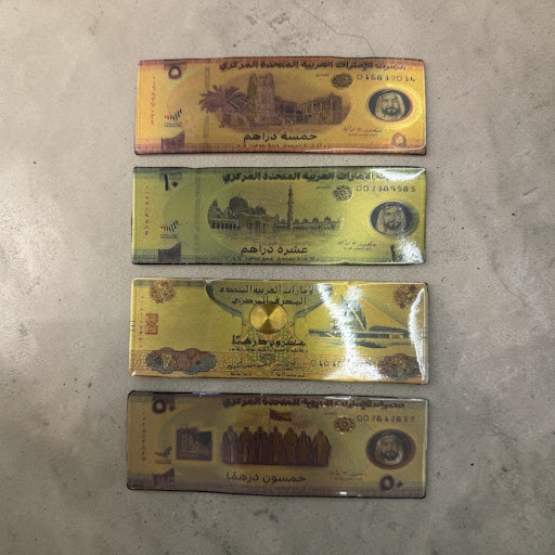 A set of 4 premium fridge magnets designed as UAE currency banknotes with a high-gloss finish.