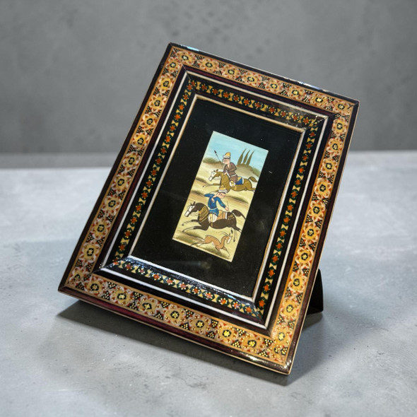 A 17.5x13.5 cm handcrafted Khatamkari inlaid wooden frame featuring a hand-painted miniature on a camel bone tile.