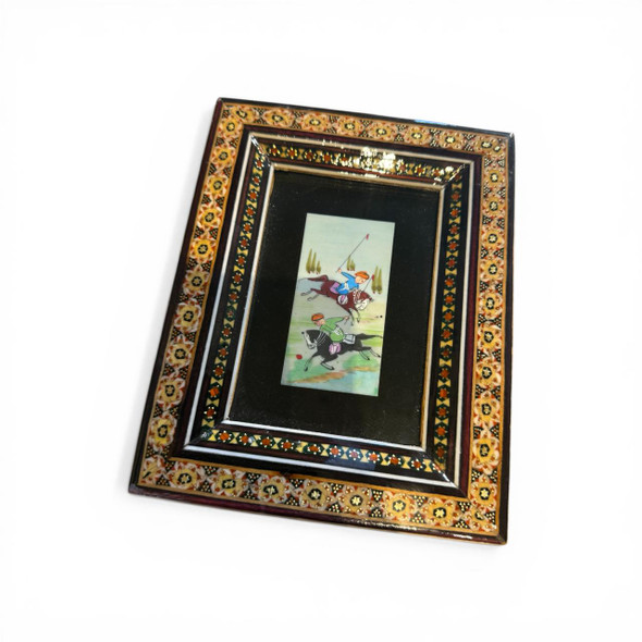 Close-up of the detailed hand-painted polo players and horses on the genuine camel bone tile within the Khatamkari frame.
