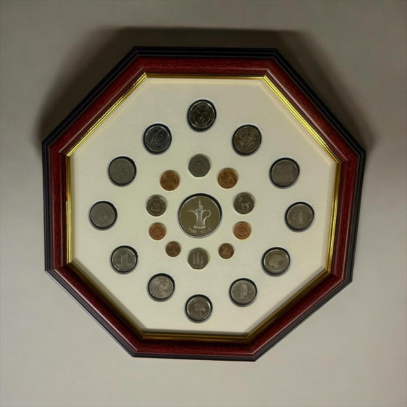 A hexagonal UAE souvenir frame featuring an artistic 3D display of real authentic Emirati coins.