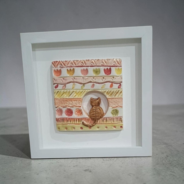 30x30 cm modern ochre gold sunburst ceramic art featuring a 3D embossed medallion tile design in a sleek frame.