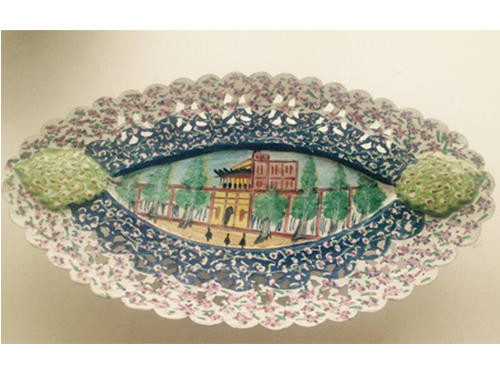 Close-up of the intricate hand-painted floral motifs and the brilliant mineral pigments on the Meenakari copper pedestal bowl.