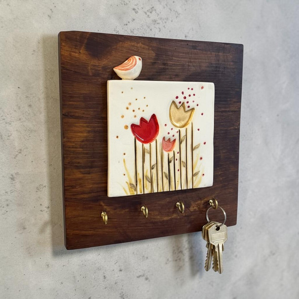 Premium 20x20 cm signature bird and flower ceramic tile key holder featuring a rustic wooden frame with hanging hooks.