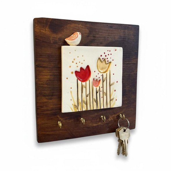 A traditional style square 20x20 cm ceramic tile wooden key rack mounted gracefully as a functional decor anchor in a hallway entryway.