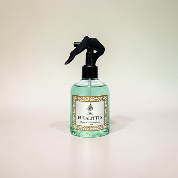 Studio presentation of the NASI Perfumes Eucalyptus room fragrance mist, featuring the clear rounded bottle centered on a minimal smooth surface.