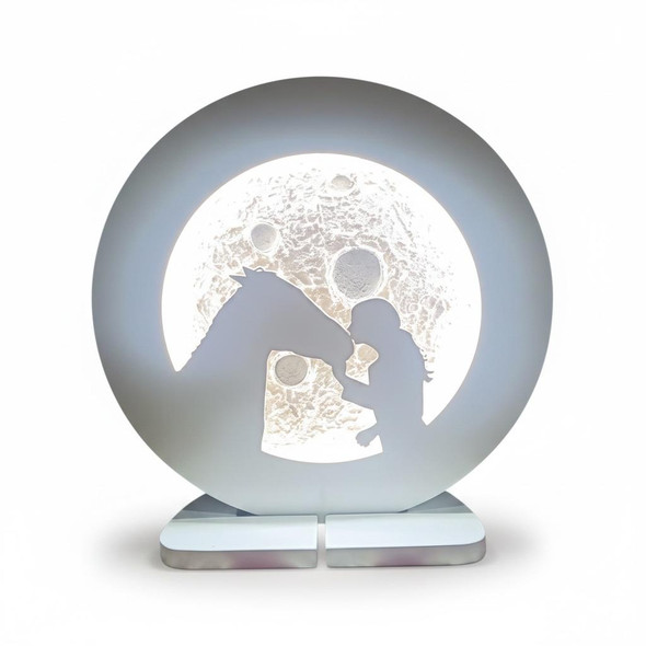 Detailed close-up of the fine sculptural lines defining the horse head and young girl silhouette sharing a gentle bond on the decorative lunar night light.