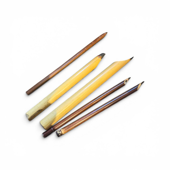 Close-up of a handcrafted Desfuli Qalam, showcasing the natural texture of the reed for professional calligraphy.