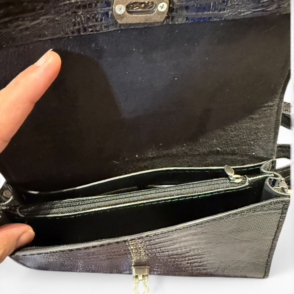 Close-up of premium handmade natural leather handbag with gold hardware.