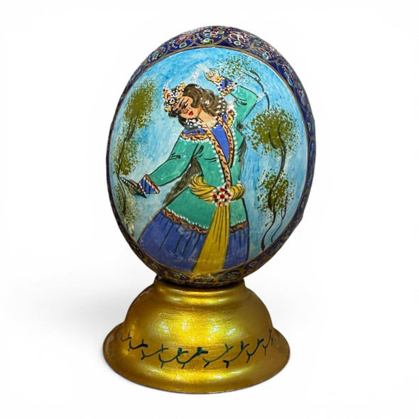 Exquisite hand-painted ostrich egg featuring a detailed traditional dancer motif, showcased